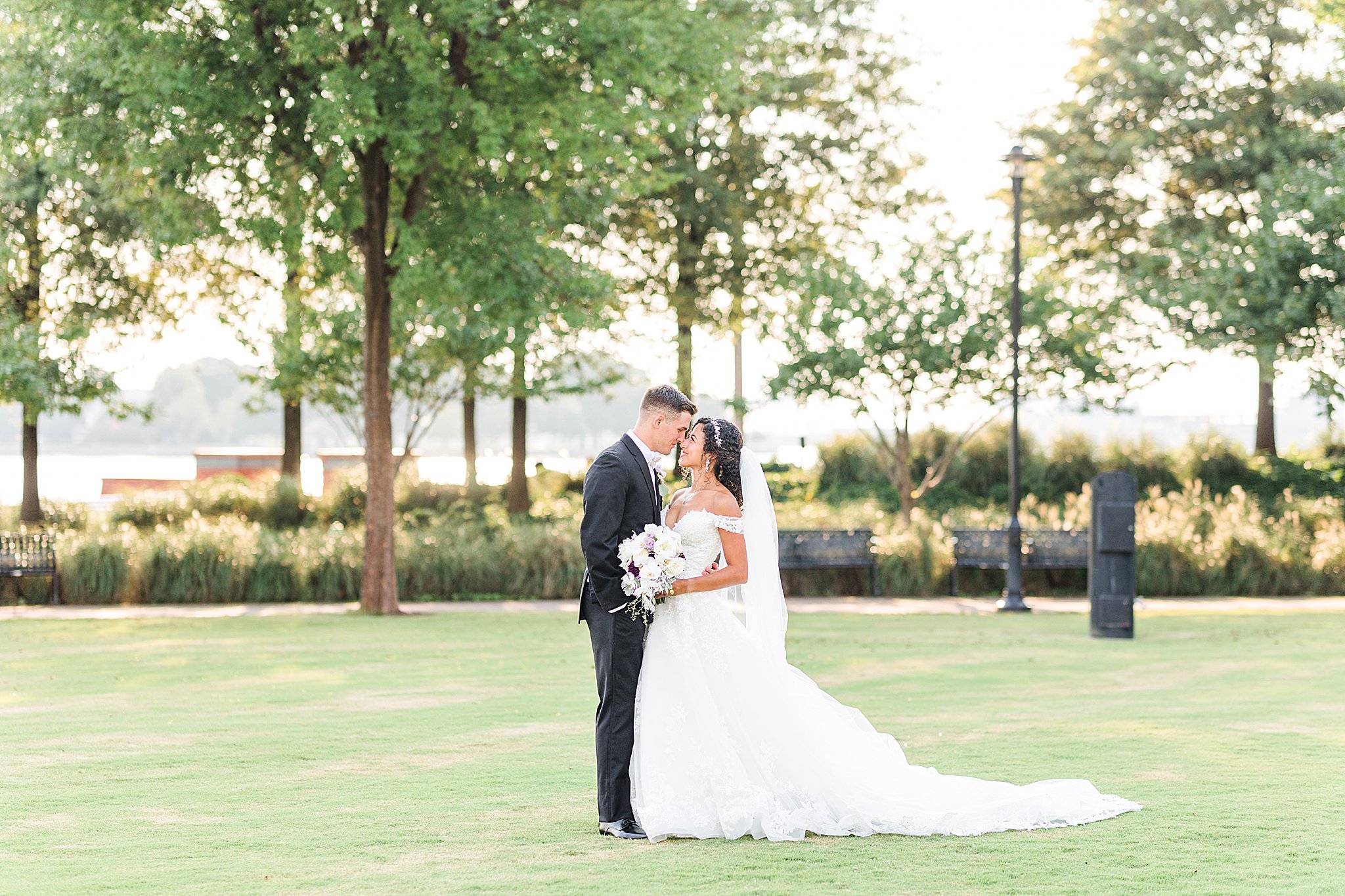 Bride and groom facing each other nose to nose