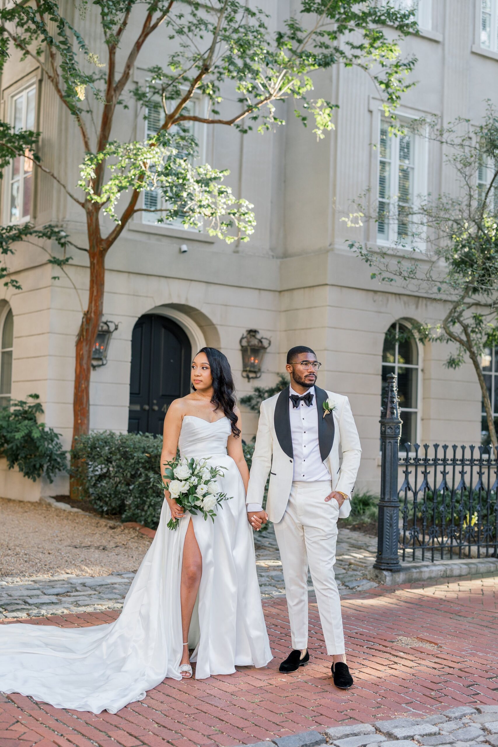 Bride and Groom posing for photo in Downtown Norfolk, Virginia.